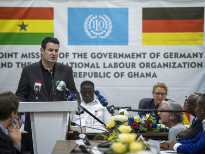 21 February 2023, Ghana, Accra: Hubertus Heil (SPD), Federal Minister of Labor and Social Affairs, speaks at a press conference at the Ministry of Labor of Ghana. Sitting behind him are Ignatius Baffour Awuah, Minister of Labor of Ghana, and Svenja Schulze (SPD), Federal Minister for Economic Cooperation and Development. …
