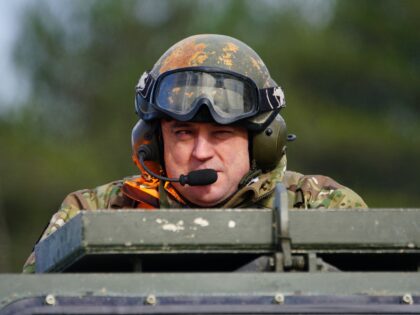 BOVINGTON, DORSET - FEBRUARY 22: Defence Secretary Ben Wallace rides in an Ajax armoured personnel carrier during a demonstration during a visit to Bovington Camp on February 22, 2023 in Bovington, Dorset. British Defence Secretary Ben Wallace is visiting a British Army military base in Dorset to see Ukrainian soldiers …