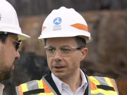 U.S. Secretary of Transportation Pete Buttigieg (C) visits with Department of Transportation Investigators at the site of the derailment on February 23 2023 in East Palestine, Ohio. On February 3rd, a Norfolk Southern Railways train carrying toxic chemicals derailed causing an environmental disaster. Thousands of residents were ordered to evacuate …
