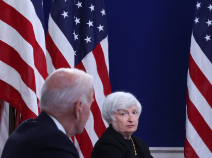 WASHINGTON, DC - OCTOBER 06: U.S. Treasury Secretary Janet Yellen (C) listens to President Joe Biden during a hybrid meeting with corporate chief executives and members of his cabinet to discuss the looming federal debt limit in the South Court Auditorium in the Eisenhower Executive Office Building on October 06, …