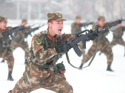 PINGLIANG, CHINA - JANUARY 27: Armed police officers and soldiers participate in a stabbing training in the snow on January 27, 2022 in Pingliang, Gansu Province of China. (Photo by He Xiaogen/VCG via Getty Images)