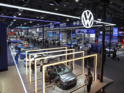 GUANGZHOU, CHINA - DECEMBER 30: People visit the Volkswagen stand during the 20th Guangzhou International Automobile Exhibition at Canton Fair Complex on December 30, 2022 in Guangzhou, Guangdong Province of China. (Photo by Zou Wei/VCG via Getty Images)