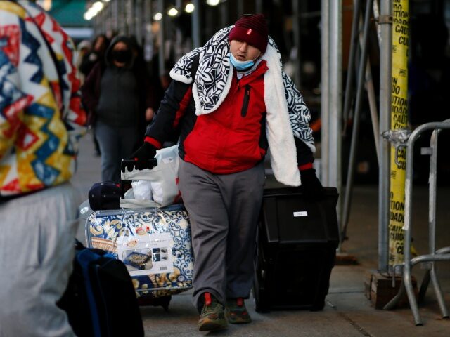 NEW YORK, NEW YORK - February 01: A migrant leaves the camp in front of the Watson Hotel after being evicted on February 01, 2023 in New York City. Dozens of migrants have been camping for days outside of a New York City luxury hotel where they had been sheltering …