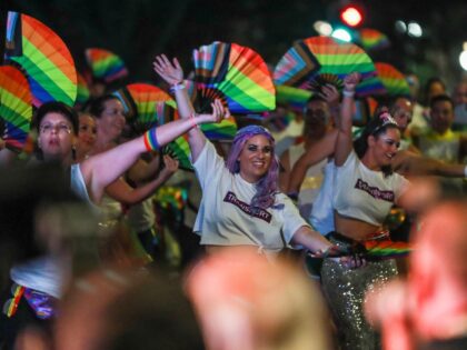 SYDNEY, AUSTRALIA - FEBRUARY 25: Parade goers walk in the Sydney Gay & Lesbian Mardi Gras