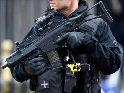 LONDON, UNITED KINGDOM - MARCH 13: (EMBARGOED FOR PUBLICATION IN UK NEWSPAPERS UNTIL 48 HOURS AFTER CREATE DATE AND TIME) A City of London armed Police officer carrying a Heckler and Koch G36 5.56 Caliber Assault Rifle, Taser and handgun on guard during a Service of Commemoration to mark the …