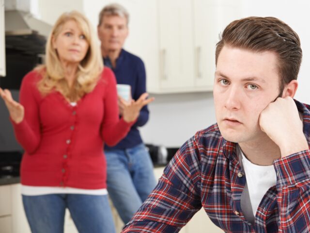 Mature Parents Frustrated With Adult Son Living At Home - stock photo