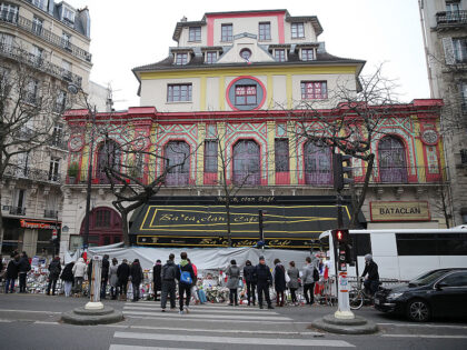 PARIS, FRANCE - DECEMBER 13: People gather in front of 'Le Bataclan' concert hall where 89 people where killed during the paris attacks a month ago on December 13, 2015 in Paris, France. (Photo by Pierre Suu/Getty Images)