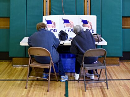 Voters take part in the 2016 Connecticut primary as they vote in the gym at the Julian Curtiss School located in Greenwich, Connecticut April 26, 2016. Polling stations opened Tuesday in Connecticut, the first of five US states to begin voting in the day's primaries, which mark a critical juncture …