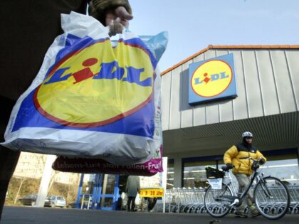 FILES- Picture taken on December 10, 2004 shows a Lidl customer carrying a shopping bag in