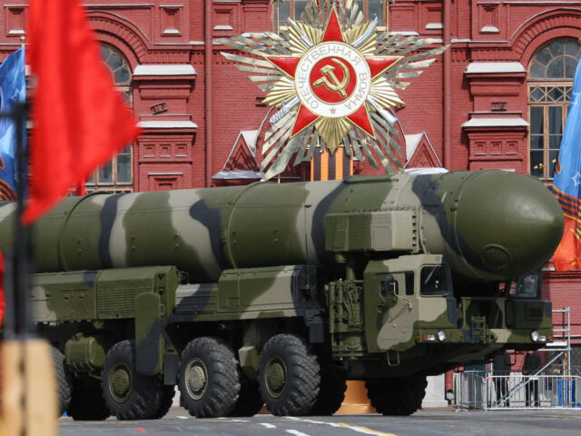 A Russian Topol-M ICBM drives across Red