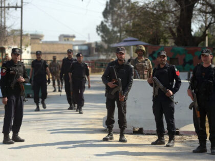 Pakistani soldiers and policemen stand guard outside central jail where an anti-terrorist court gave a verdict against suspects accused in a blasphemy lynching case in Haripur district on February 7, 2018. A Pakistani court sentenced one person to death and five others to life imprisonment on February 7 for lynching …