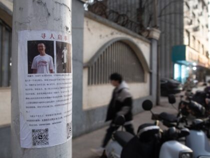 SHANGRAO, CHINA - JANUARY 30: A missing persons poster of Hu Xinyu is seen on a telegraph
