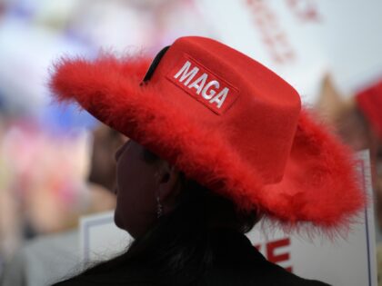 A supporter of Former US President Donald Trump wears a "Make America Great Again" hat during a rally in Youngstown, Ohio, US, on Saturday, Sept. 17, 2022. The 2022 election season kicked off with Republicans poised to take control of at least the House thanks to voter outrage over high …