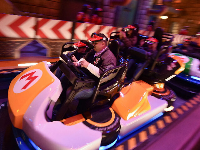 Guests ride Super Mario Kart during a preview of Super Nintendo World at Universal Studios