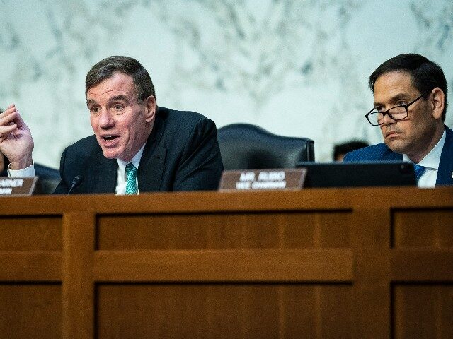 Chairman Mark Warner, D-Va., left, and Sen. Marco Rubio, R-Fla., speak during a Senate Intelligence Committee hearing on worldwide threats as Russia continues to attack Ukraine, on Capitol Hill on Thursday, March 10, 2022 in Washington, DC. (Photo by Jabin Botsford/The Washington Post via Getty Images)