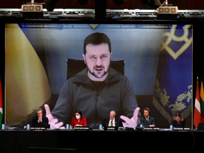 krainian President Volodymyr Zelensky is seen on a giant screen as he delivers a speech during NATO Parliamentary Assembly annual session held in Madrid on November 21, 2022. (Photo by OSCAR DEL POZO / AFP) (Photo by OSCAR DEL POZO/AFP via Getty Images)