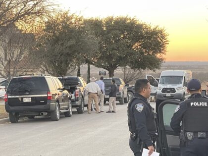 Eagle Pass, Texas, police officers and Texas Rangers execute a search warrant at a residence near the state's border with Mexico during the search for a missing corrections officer. (Randy Clark/Breitbart Texas)