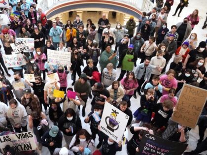 Trans-rights activists protest outside the House chamber at the state Capitol before the State of the State address Monday, Feb. 6, 2023, in Oklahoma City. (Sue Ogrocki/AP)