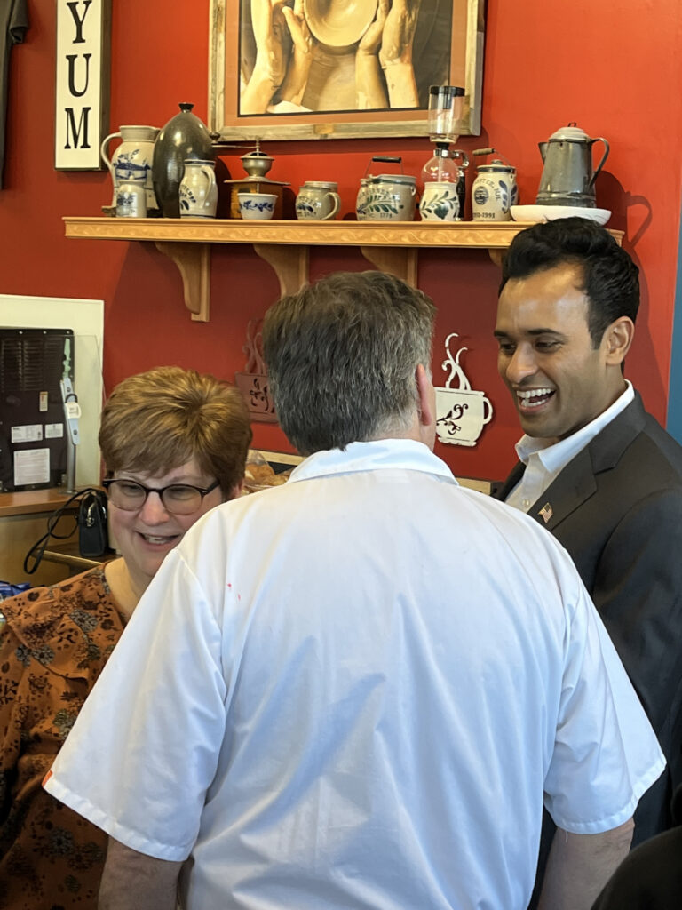 Vivek Ramaswamy talks with Granite Staters at Potter’s Bakery in Rochester, New Hampshire, on February 22, 2023 (Nick Gilbertson/Breitbart News).