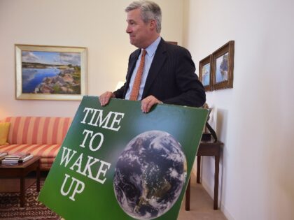 With AFP Story by Michael MATHES: US-politics-environment-climate,INTERVIEW Senator Sheldon Whitehouse, D-RI, holds a placard which he had with him during his speeches on the floor of the Senate during an interview with Agence France-Presse at his office in the Hart Senate Office Building on May 14, 2015 on Capitol Hill …