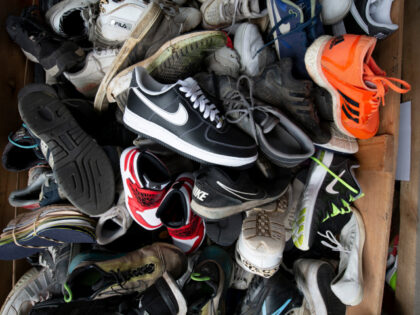 Used and new sport shoes wait to be recycled at Fast Feet Grinded, the world's first shoe