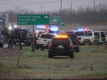 Law Enforcement and EMS workers at the scene of a Border Patrol agent-involved shooting ne