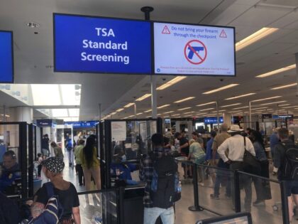 TSA Standard Screening A sign warns travelers not to bring guns through the Transportation Security Administration checkpoint at Orlando International Airport in Orlando, Florida, on Saturday, April 23, 2022. (AP Photo/Ted Shaffrey)