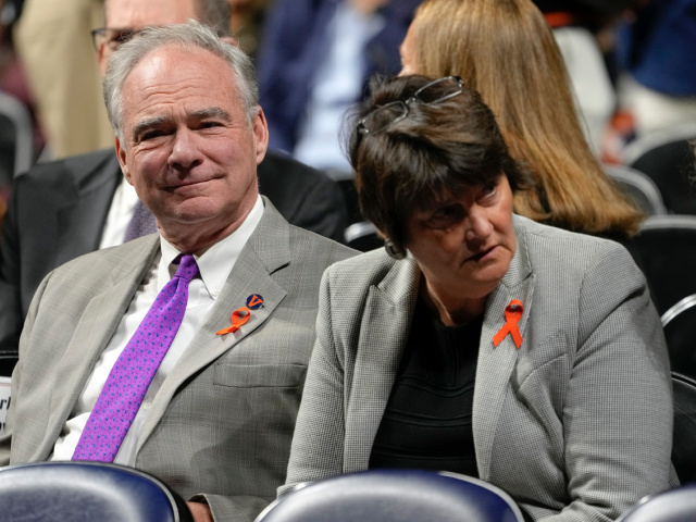 CHARLOTTESVILLE, VIRGINIA - NOVEMBER 19: Sen. Tim Kaine, D-Va., and his wife Anne Holton are seated for a memorial service for three slain University of Virginia football players at John Paul Jones Arena at the school on November 19, 2022 in Charlottesville, Virginia. Christopher Darnell Jones Jr. was apprehended in …