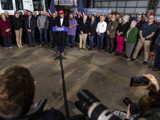 EAST PALESTINE, OH - FEBRUARY 22: Former President Donald Trump stands next to a pallet of