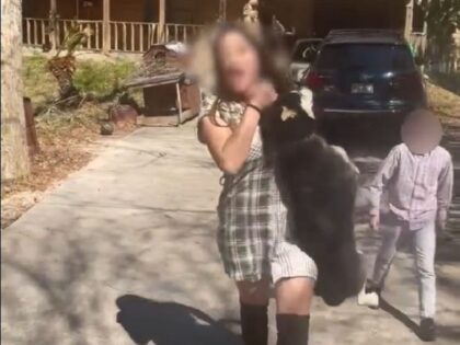 Constable Alan Rosen tweeted a video showing a woman allegedly abusing a dog in front of a child. (Harris County Precinct 1 Constable's Office)