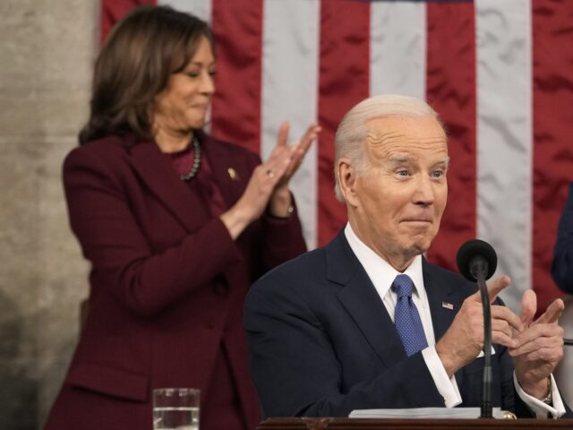 US President Joe Biden gestures while speaking during a State of the Union address at the