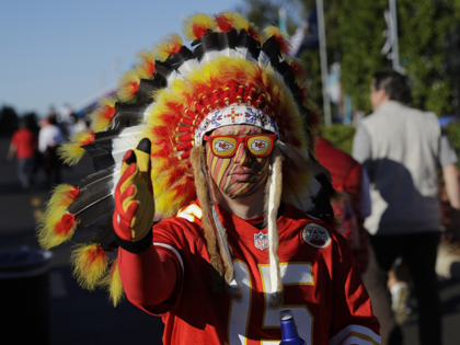 In this Feb. 2, 2020 file photo, a Kansas City Chiefs fan walks outside the stadium before the NFL Super Bowl 54 football game between the San Francisco 49ers and Kansas City Chiefs in Miami Gardens, Fla. The Kansas City Chiefs fans who file into Arrowhead stadium Thursday, Sept. 10, …