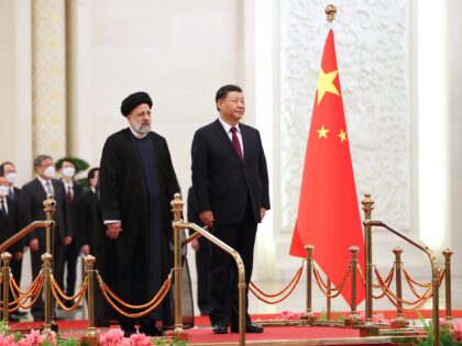 BEIJING, CHINA - FEBRUARY 14: (----EDITORIAL USE ONLY - MANDATORY CREDIT - 'IRANIAN PRESIDENCY / HANDOUT' - NO MARKETING NO ADVERTISING CAMPAIGNS - DISTRIBUTED AS A SERVICE TO CLIENTS----) Iranian President Ebrahim Raisi (L) being welcomed by Chinese President Xi Jinping (R) with an official ceremony in Beijing, China on …