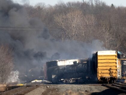 Smoke rises from a derailed cargo train in East Palestine, Ohio, on February 4, 2023. - The train accident sparked a massive fire and evacuation orders, officials and reports said Saturday. No injuries or fatalities were reported after the 50-car train came off the tracks late February 3 near the …