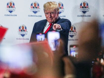 Former US President Donald Trump gestures to supporters during Trump's President Day event