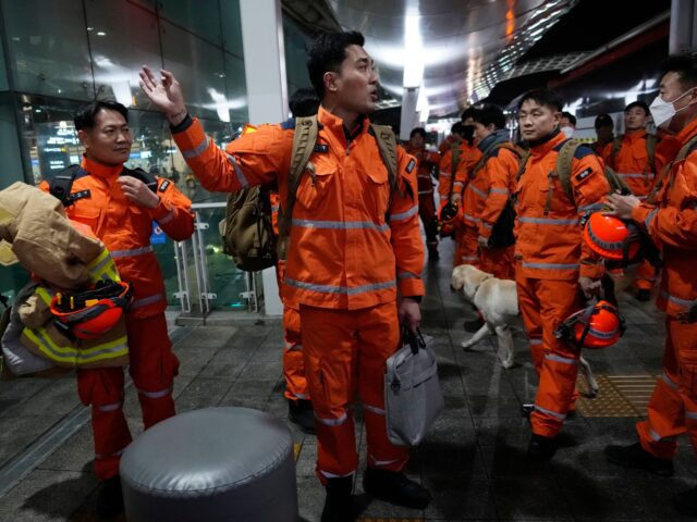 South Korean rescue team members prepare to board a plane for quake-ravaged Turkey at the Incheon International Airport in Incheon, South Korea, Tuesday, Feb. 7, 2023. (AP Photo/(AP Photo/Ahn Young-joon)