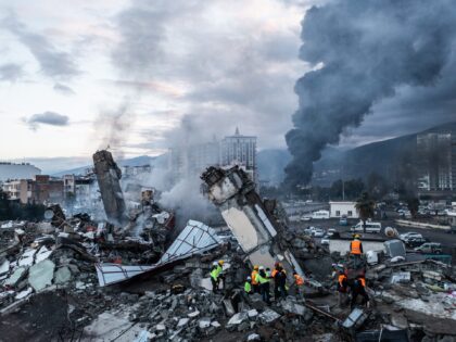HATAY, TURKEY - FEBRUARY 07: Smoke billows from the Iskenderun Port as rescue workers work at the scene of a collapsed building on February 07, 2023 in Iskenderun, Turkey. A 7.8-magnitude earthquake hit near Gaziantep, Turkey, in the early hours of Monday, followed by another 7.5-magnitude tremor just after midday. …