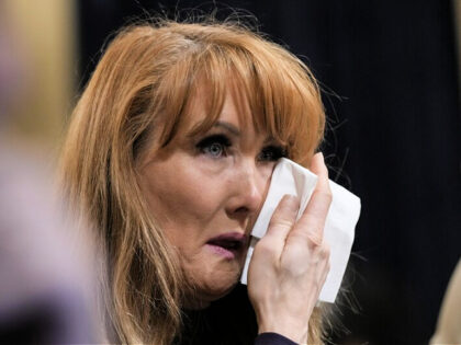 WASHINGTON, DC - FEBRUARY 28: Rebecca Kiessling, a mother from Michigan who lost two sons to fentanyl poisoning, wipes away tears during a House Homeland Security Committee about the U.S-Mexico border on Capitol Hill February 28, 2023 in Washington, DC. This is the committee's first hearing on border security since …