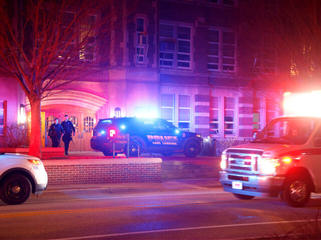 Police investigate the scene of a shooting at Berkey Hall on the campus of Michigan State