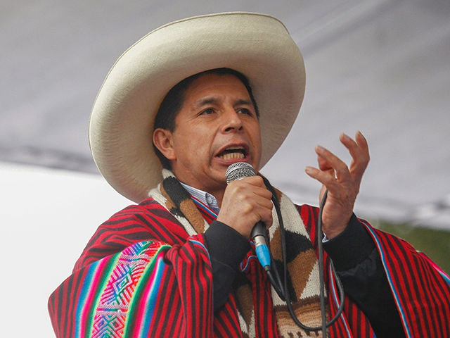 Peruvian President Pedro Castillo, dressed in typical Andean attire, speaks during a massi