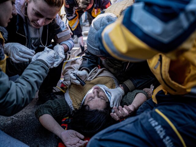 HATAY, TURKIYE - FEBRUARY 9: A woman is rescued from the rubble 84 hours after a building