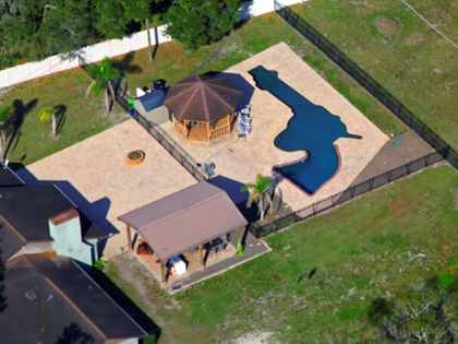 This Jan. 24, 2023 photo shows the gun shaped pool in the backyard of Louis and Raye Ellen
