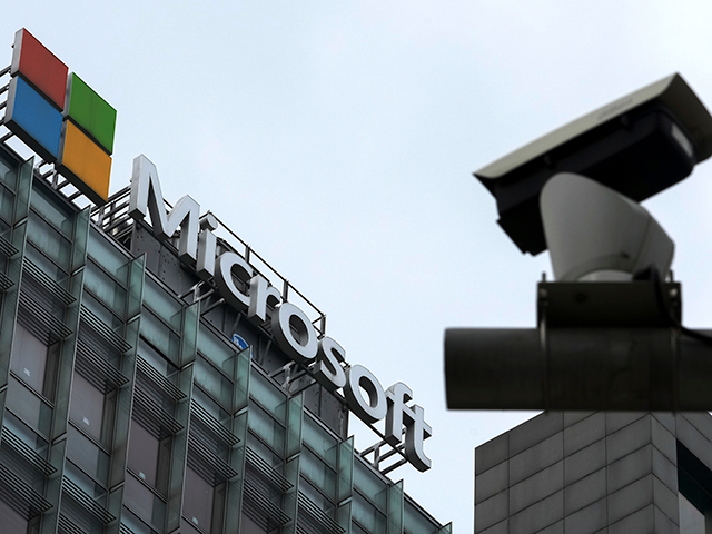 A security surveillance camera is seen near the Microsoft office building in Beijing, July