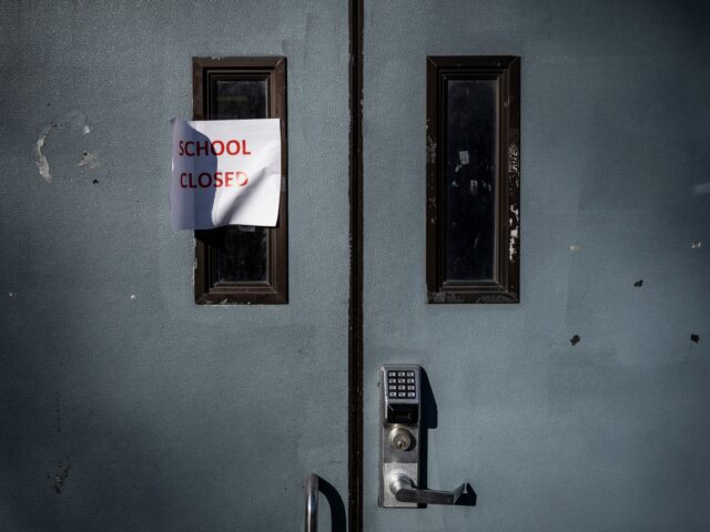 A "School Closed" sign at an entrance to the Pulaski International School of Chicago after