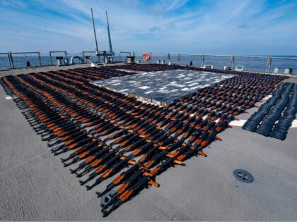 In this Dec. 21, 2021, photo released by the U.S. Navy, Illicit weapons seized from a stateless fishing vessel in the North Arabian Sea are arranged for inventory aboard guided-missile destroyer USS O'Kane's (DDG 77) flight deck. The U.S. Navy seized a large cache of assault rifles and ammunition being …