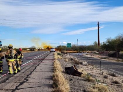 Arizona authorities closed a portion of a freeway and issued a shelter-in-place order in the surrounding areas after a commercial truck tanker rolled over on the freeway and spilled nitric acid on Tuesday.