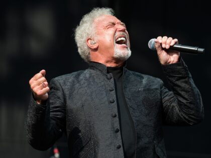 CHELMSFORD, ENGLAND - AUGUST 19: Tom Jones performs on the Virgin Media Stage on day 2 of the V Festival at Hylands Park on August 19, 2012 in Chelmsford, England. (Photo by Samir Hussein/Getty Images)