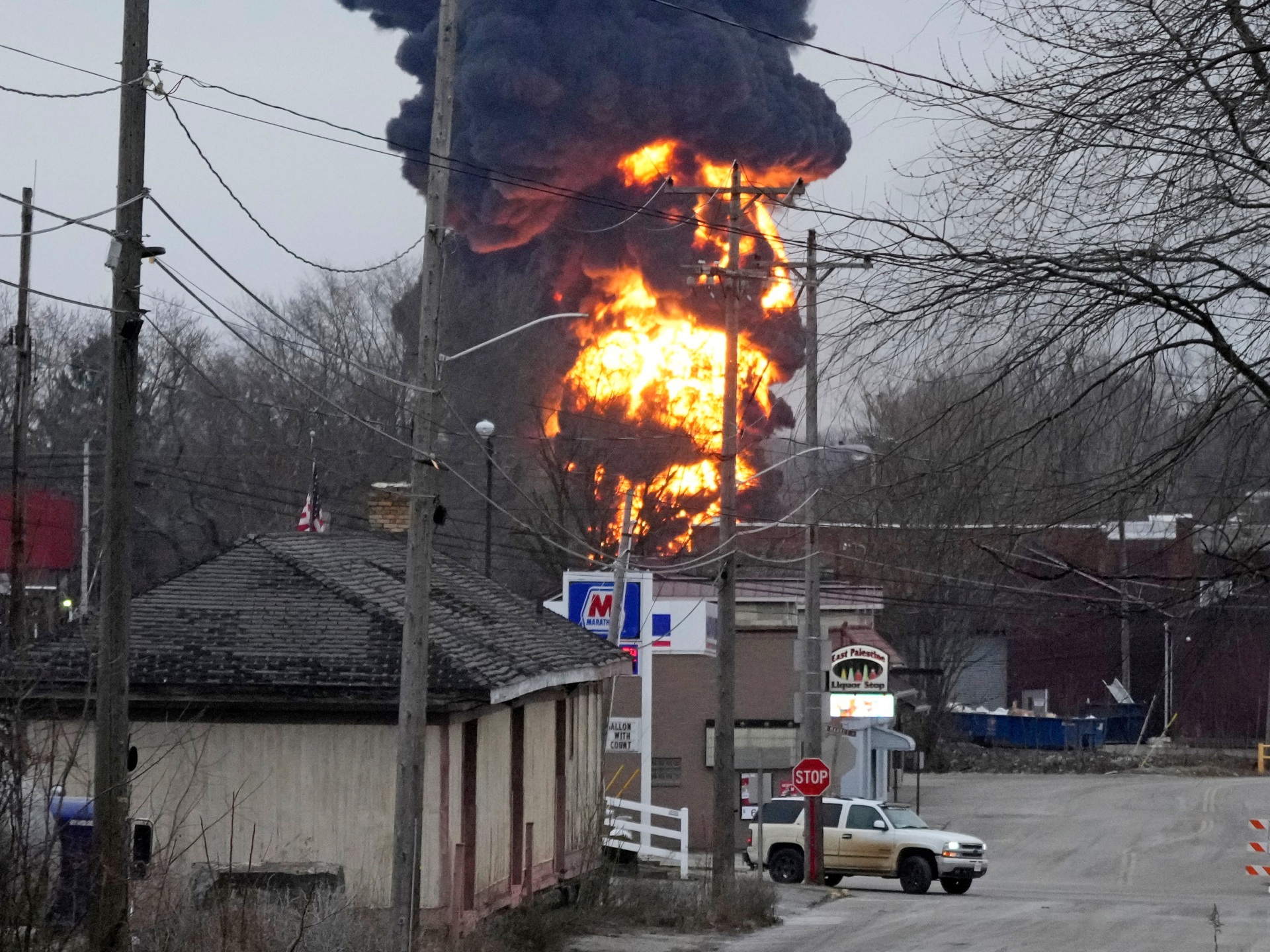 A black plume and fireball rise over East Palestine, Ohio, as a result of a controlled detonation of a portion of the derailed Norfolk Southern trains Monday, Feb. 6, 2023. (AP Photo/Gene J. Puskar)