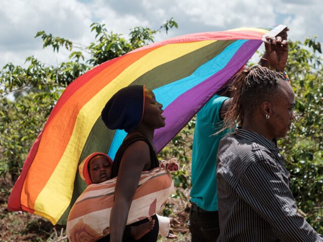 LGBT refugees from South Sudan, Uganda and DR Congo walk on the way to their protest to de