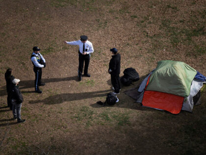 Park Police talk to a man who refused to leave after members of the US National Park Servi